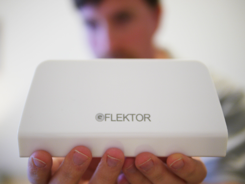 eFLEKTOR Founder Jason Rhoades holding the first production eFLEKTOR